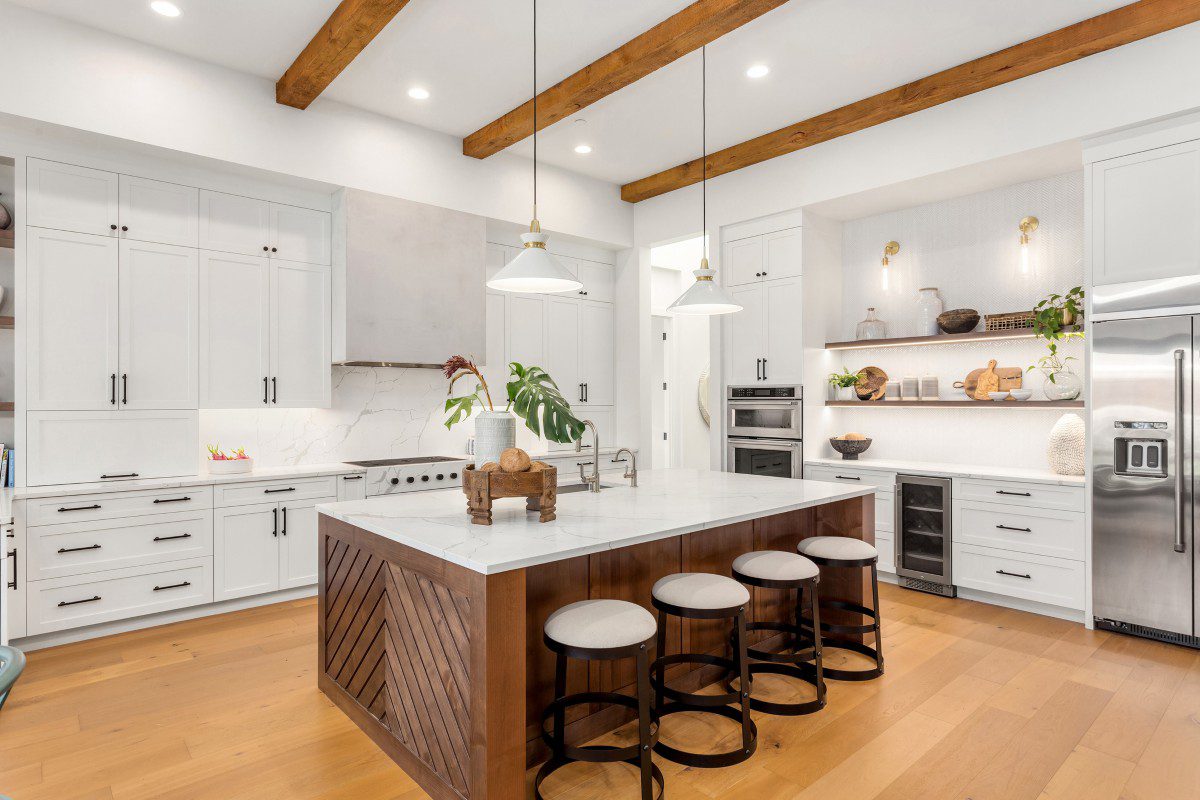 Modern kitchen with island and wooden accents.