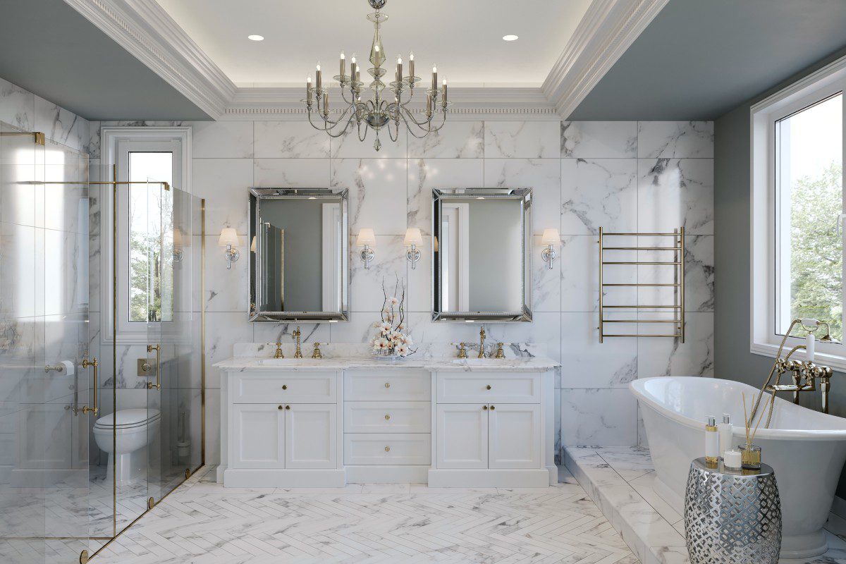 Luxurious marble bathroom with chandelier lighting.