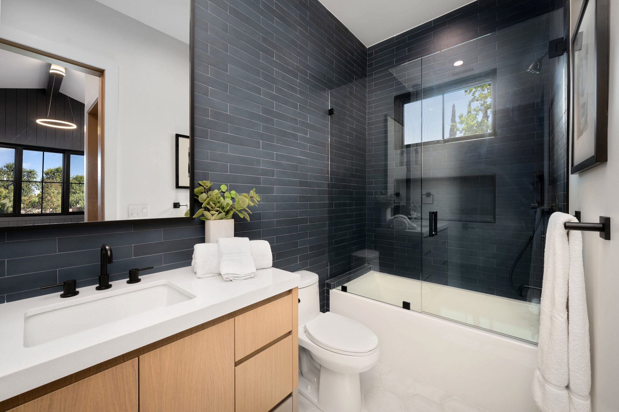 Modern bathroom with glass shower and white vanity. Modern bathroom with glass shower enclosure.