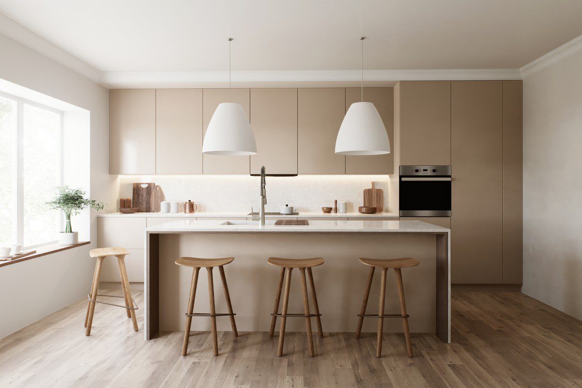 Modern kitchen with island and bar stools.