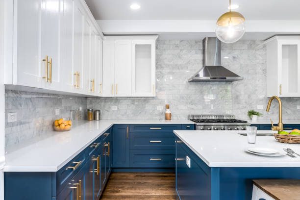 kit-11 Modern kitchen with blue and white cabinets.
